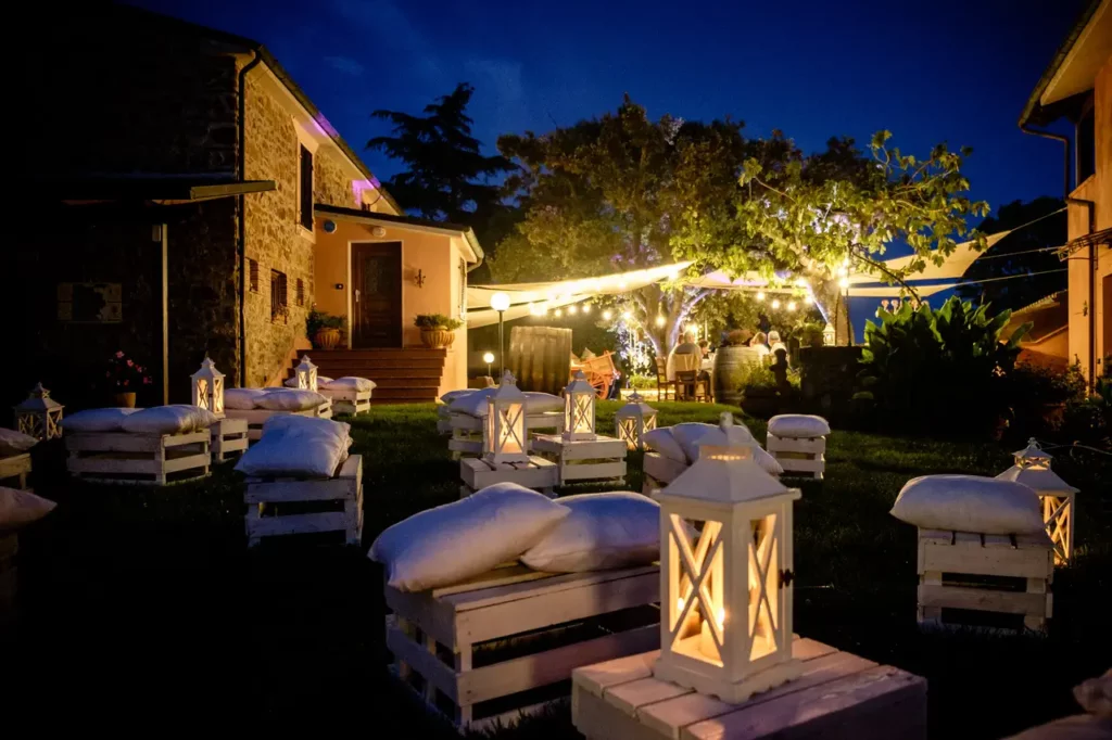 Patio area and outdoor seating area with candles and pillows