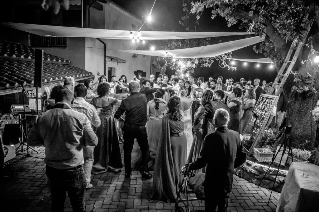 The bride and groom and guests during the Dance Party