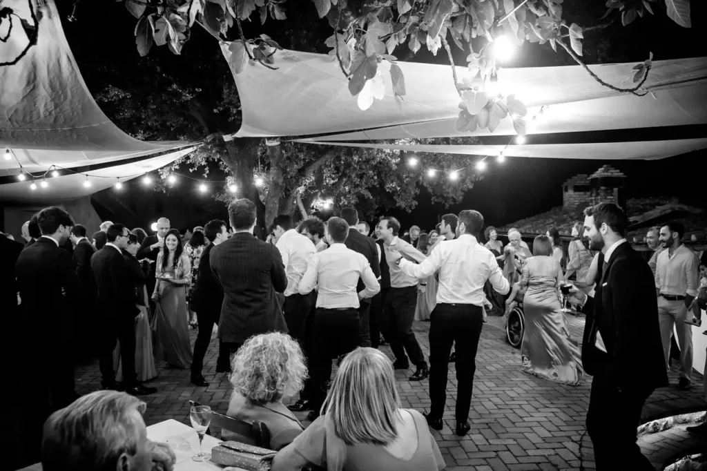 The bride and groom and guests during the Dance Party